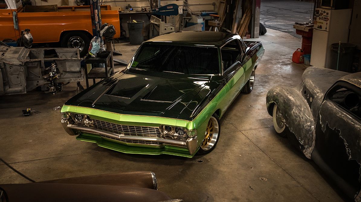 A Green Chevrolet Caprice Car in a Garage