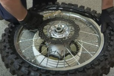 INSTALATION OF A  NEW DIRT BIKE TIRE