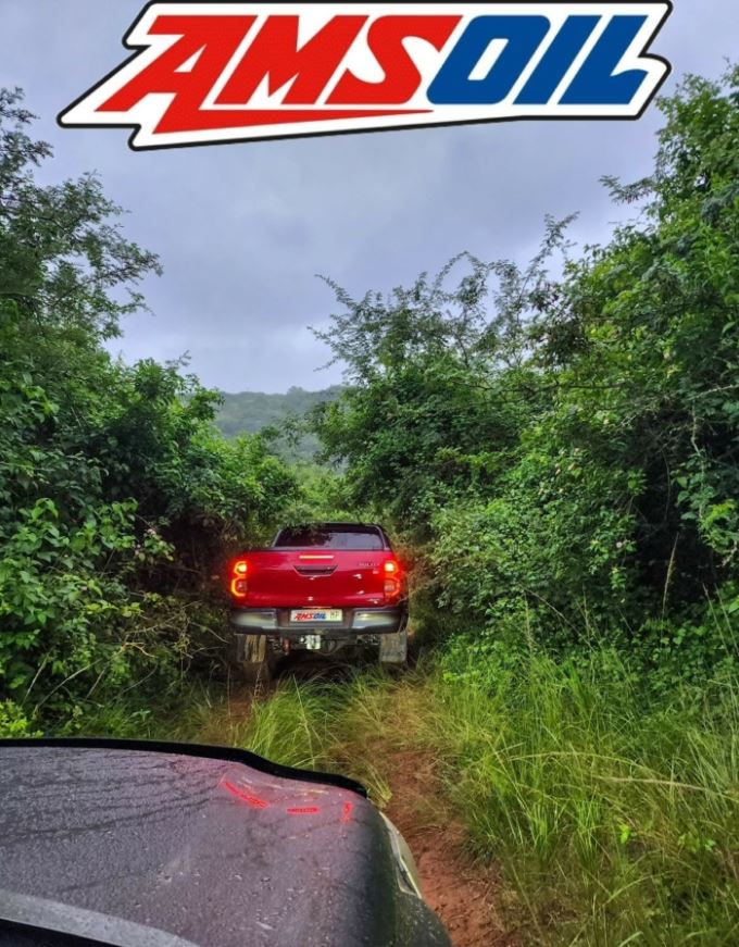 Vehicles using AMSOIL motor oil on jungle tracks