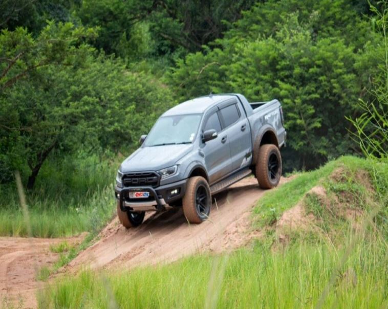 A car is going down a steep hill.